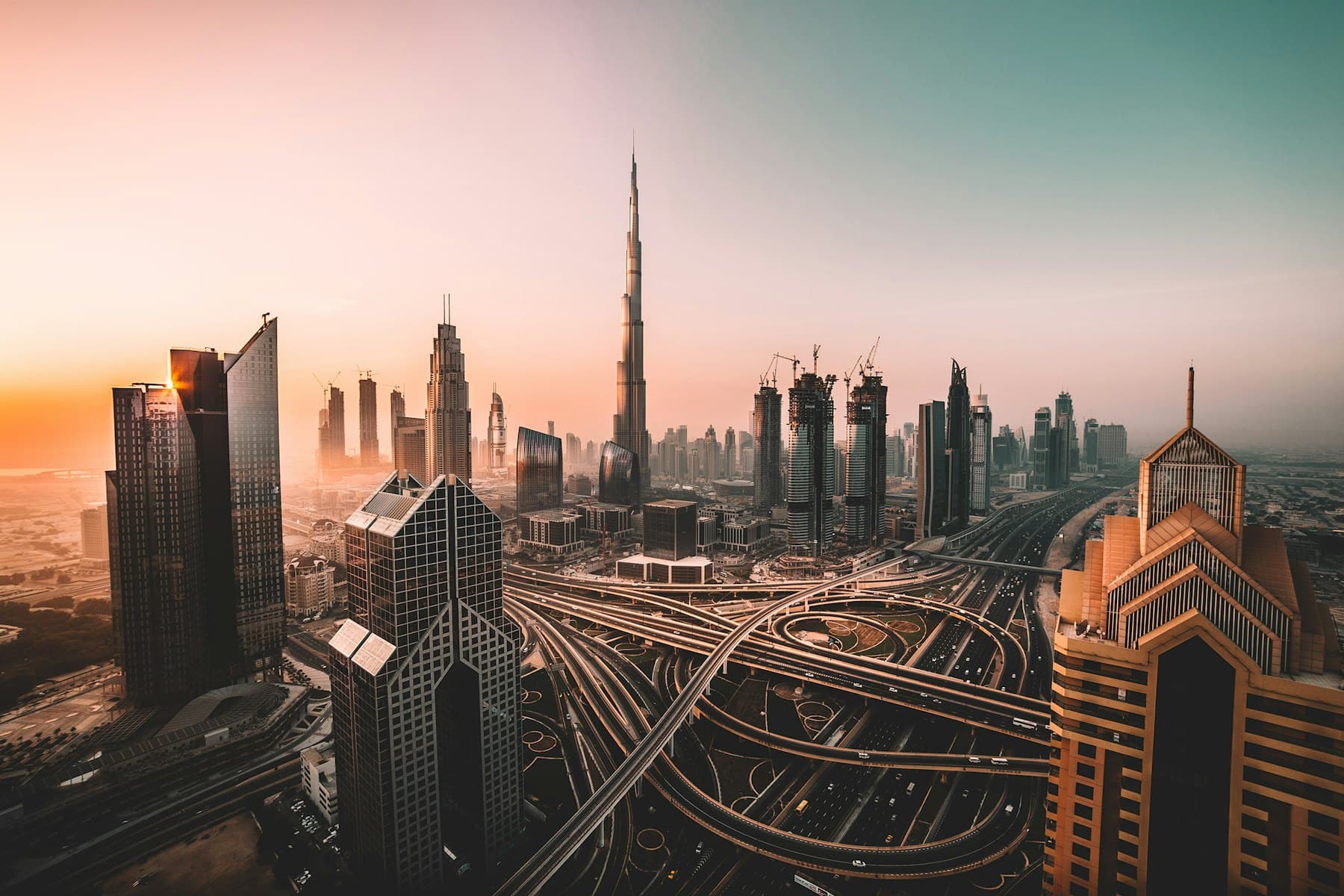 The Dubai skyline above a multi level highway interchange