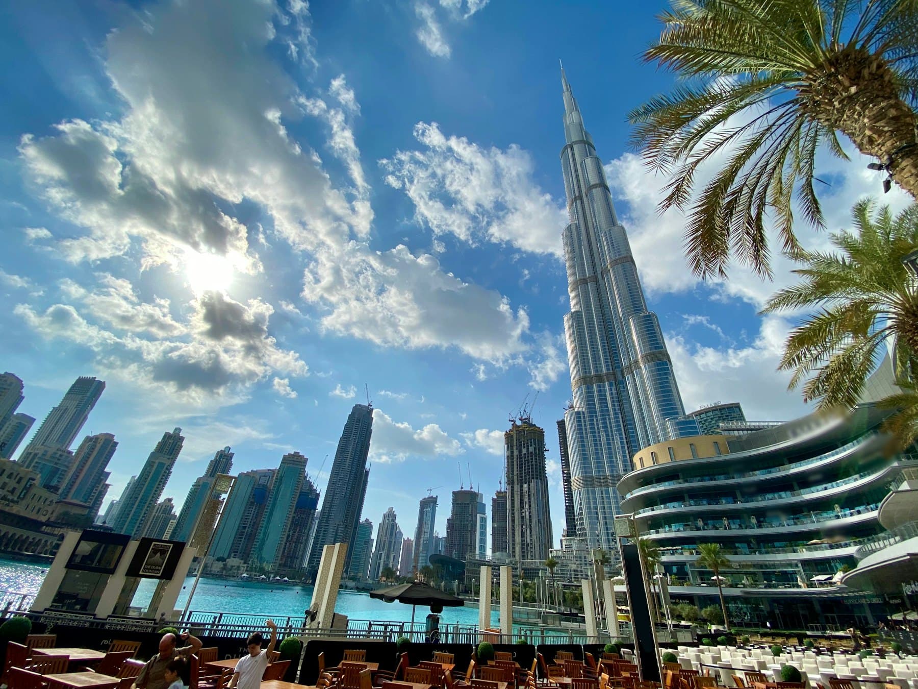 Glass and steel towers in Dubai seen against open sky